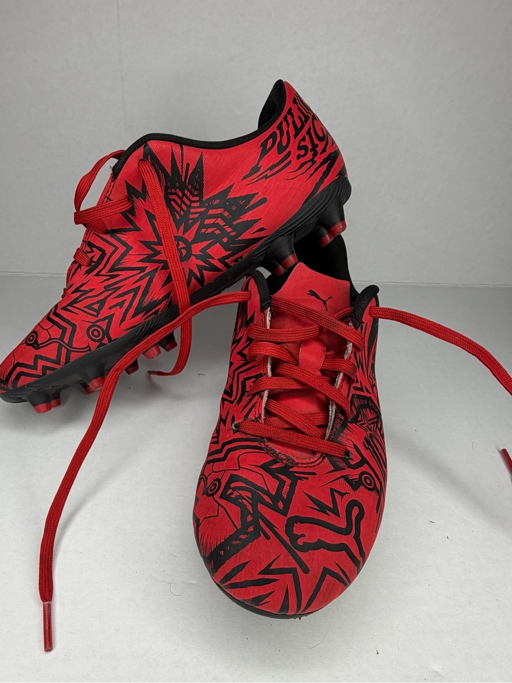 PUMA Youth Soccer Cleats Size 4.5 Red Black Graphic Print Firm Ground